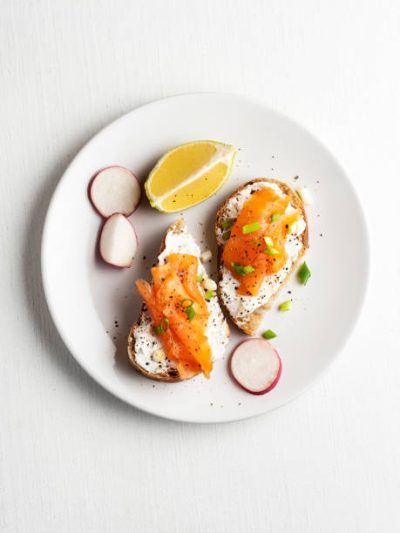 Crostini topped with smoked salmon and sour cream